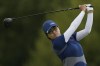 Rose Zhang, of the United States, hits her shot from the 14th tee during the third round of the women's golf event at the 2024 Summer Olympics, Friday, Aug. 9, 2024, at Le Golf National, in Saint-Quentin-en-Yvelines, France. (AP Photo/Matt York)