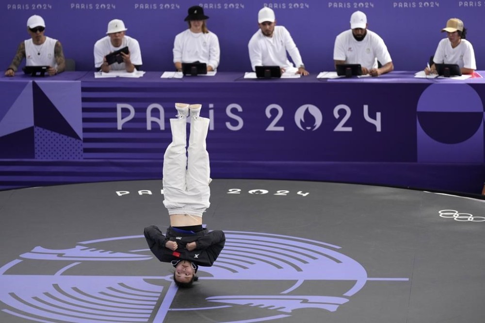 China's Qingyi Liu, known as B-Girl 671, competes during the Round Robin Battle at the breaking competition at La Concorde Urban Park at the 2024 Summer Olympics, Friday, Aug. 9, 2024, in Paris, France. (AP Photo/Abbie Parr)