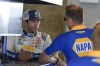 Chase Elliott talks with a crew members before a practice session for the NASCAR Cup Series auto race at Indianapolis Motor Speedway, Friday, July 19, 2024, in Indianapolis. (AP Photo/Darron Cummings)