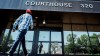 Lawyers for two men convicted of mischief at the 2022 border blockade at Coutts, Alta., are scheduled to appear in court Monday to determine next steps in sentencing. A man enters the courthouse in Lethbridge, Friday, Aug. 2, 2024. THE CANADIAN PRESS/Jeff McIntosh