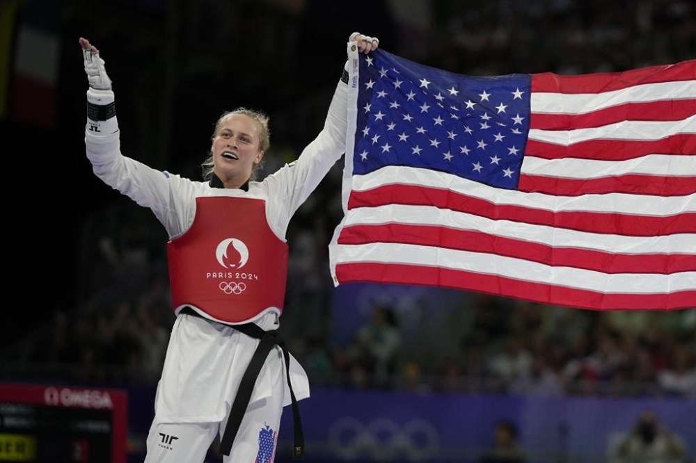 United States' Kristina Teachout celebrates after winning the women's 67kg Taekwondo bronze final match against China's Song Jie during the 2024 Summer Olympics, at the Grand Palais, Friday, Aug. 9, 2024, in Paris, France. (AP Photo/Andrew Medichini)