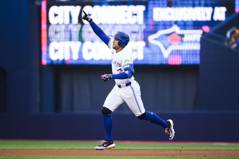 Toronto Blue Jays' George Springer (4) celebrates as he rounds the bases after hitting a solo home run during first inning MLB baseball action against the Oakland Athletics, in Toronto on Friday, Aug. 9, 2024. THE CANADIAN PRESS/Christopher Katsarov