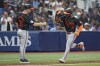 Baltimore Orioles' Cedric Mullins (31) celebrates his home run off Tampa Bay Rays relief pitcher Richard Lovelady with third base coach Tony Mansolino during the sixth inning of a baseball game Friday, Aug. 9, 2024, in St. Petersburg, Fla. (AP Photo/Christopher O'Meara)