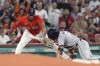 Houston Astros' Jake Meyers (6) is safe at third base with a triple as Boston Red Sox third baseman Rafael Devers gets the late throw during the seventh inning of a baseball game, Friday, Aug. 9, 2024, in Boston. (AP Photo/Michael Dwyer)