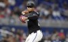 Miami Marlins pitcher Edward Cabrera throws to first base during the second inning of a baseball game against the San Diego Padres, Friday, Aug. 9, 2024, in Miami. (AP Photo/Michael Laughlin)