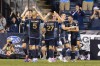 Philadelphia Union players celebrate after the second goal by Tai Baribo, right, during the second half of a Leagues Cup soccer game against CF Montreal, Friday, Aug. 9, 2024, in Chester, Pa. (AP Photo/Chris Szagola)