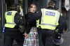 A woman gets arrested ahead of a far-right anti-immigration protest in Newcastle, England, Saturday, Aug. 10, 2024.(AP Photo/Scott Heppell)
