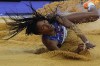 Tara Davis-Woodhall, of the United States, competes in the women's long jump final, at the 2024 Summer Olympics, Thursday, Aug. 8, 2024, in Saint-Denis, France. (AP Photo/Rebecca Blackwell)