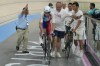 Benjamin Thomas of France is helped to get into the track after falling, during the men's omnium event, at the Summer Olympics, Thursday, Aug. 8, 2024, in Paris, France. (AP Photo/Ricardo Mazalan)