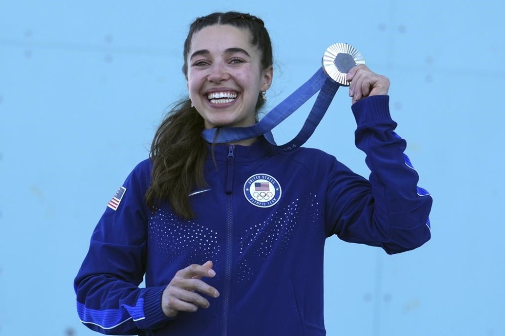 Silver medallist Brooke Raboutou of the United States poses with her medal afer the women's boulder and lead final during the sport climbing competition at the 2024 Summer Olympics, Saturday, Aug. 10, 2024, in Le Bourget, France. (AP Photo/Tsvangirayi Mukwazhi)