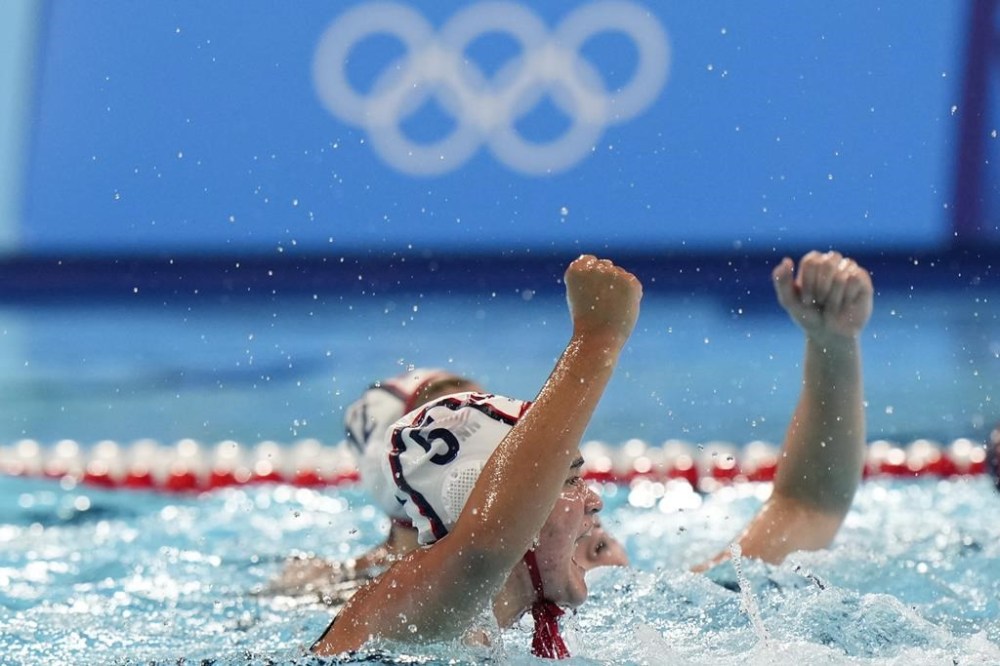 United States' Jenna Michelle Flynn celebrates after scoring against Netherlands during the women's bronze medal water polo match at the 2024 Summer Olympics, Saturday, Aug. 10, 2024, in Paris. (AP Photo/Luca Bruno)