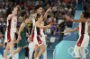 Team USA celebrate a basket against Australia during a women's semifinal basketball game at Bercy Arena at the 2024 Summer Olympics, Friday, Aug. 9, 2024, in Paris, France. (AP Photo/Michael Conroy)