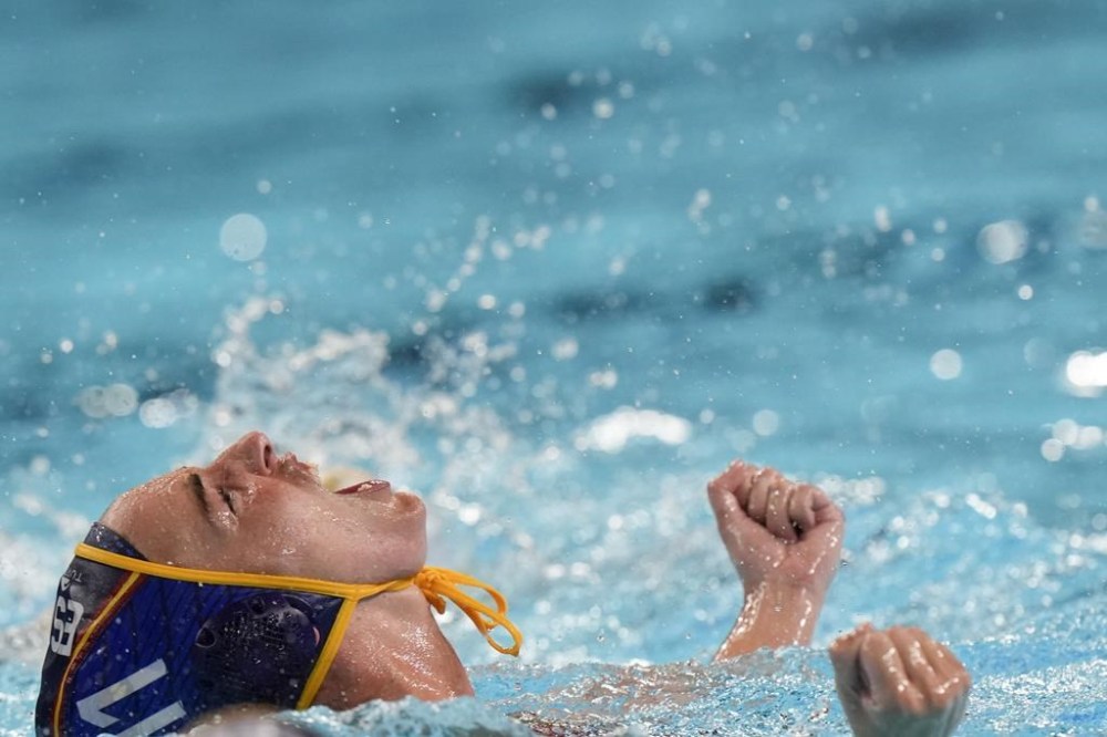 Spain's Maica Garcia Godoy celebrates after scoring during the women's gold medal water polo match between Australia and Spain, at the 2024 Summer Olympics, Saturday, Aug. 10, 2024, in Paris, France. (AP Photo/Luca Bruno)