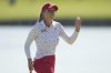 Brooke Henderson, of Canada, acknowledges the crowd after putting on the 18th green during the final round of the women's golf event at the 2024 Summer Olympics, Saturday, Aug. 10, 2024, at Le Golf National, in Saint-Quentin-en-Yvelines, France. THE CANADIAN PRESS/AP-Matt York