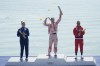 Silver medalist Nevin Harrison, of the United States, from left, gold medalist Katie Vincent, of Canada, and bronze medalist Yarisleidis Cirilo Duboys, of Cuba, pose during a medals ceremony for the women's canoe single 200-meter finals at the 2024 Summer Olympics, Saturday, Aug. 10, 2024, in Vaires-sur-Marne, France. (AP Photo/Lindsey Wasson)