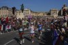 Competitors run past spectators near the Palace of Versailles during the men's marathon at the 2024 Summer Olympics, Saturday, Aug. 10, 2024, in Versailles, France. THE CANADIAN PRESS/AP-POOL, Rebecca Blackwell