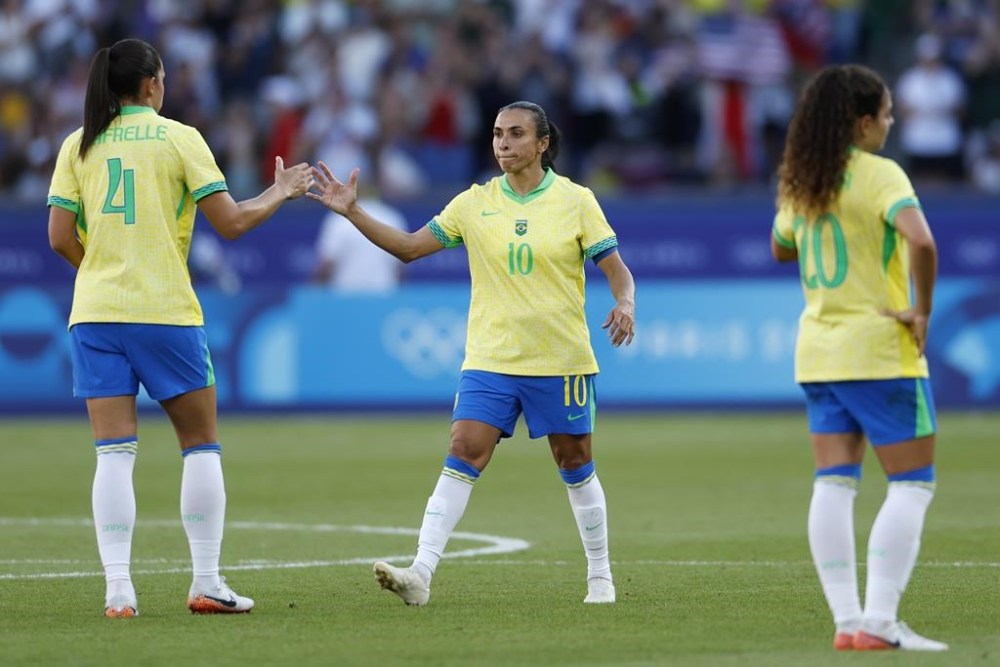 Brazil's Marta greets Brazil's Rafaelle after the women's soccer gold medal match between Brazil and the United States at the Parc des Princes during the 2024 Summer Olympics, Saturday, Aug. 10, 2024, in Paris, France. (AP Photo/Aurelien Morissard)