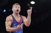 Kyle Douglas Dake, of the United States, reacts during their men's freestyle 74kg bronze medal wrestling match against Serbia's Hetik Cabolov, at Champ-de-Mars Arena, during the 2024 Summer Olympics, Saturday, Aug. 10, 2024, in Paris, France. (AP Photo/Eugene Hoshiko)