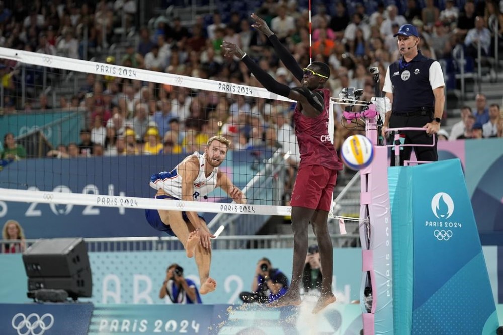 Norway's Christian Sandlie Sorum spikes the ball for a point during the beach volleyball men's bronze medal match at the 2024 Summer Olympics, Saturday, Aug. 10, 2024, in Paris, France. (AP Photo/Robert F. Bukaty)