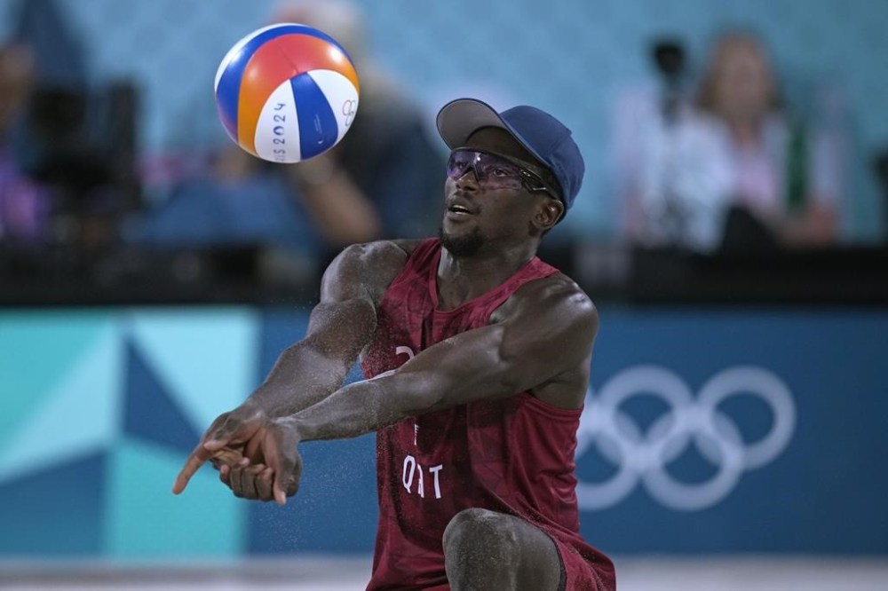 Qatar's Ahmed Tijan in action against Norway during the beach volleyball men's bronze medal match at the 2024 Summer Olympics, Saturday, Aug. 10, 2024, in Paris, France. (AP Photo/Louise Delmotte)