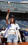 WNBA basketball player Caitlin Clark throws a baseball before a baseball double game between the New York Yankees and the Texas Rangers, Saturday, Aug. 10, 2024 in New York. (AP Photo/Noah K. Murray)