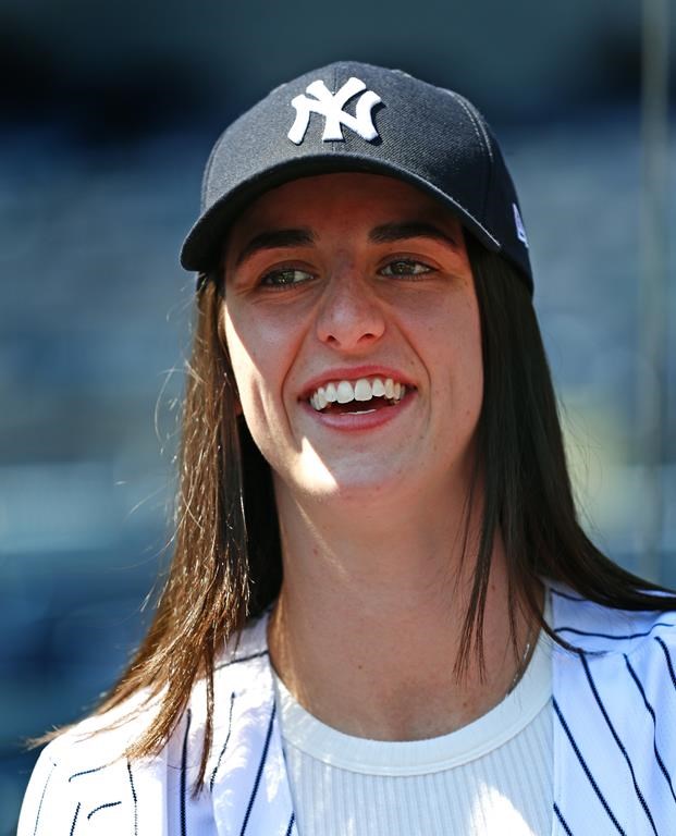 WNBA basketball player Caitlin Clark is photographed before a baseball double header game between the New York Yankees and the Texas Rangers, Saturday, Aug. 10, 2024 in New York. (AP Photo/Noah K. Murray)