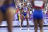 Masai Russell, of the United States, reacts after winning the gold medal in the women's 100 meters hurdles final at the 2024 Summer Olympics, Saturday, Aug. 10, 2024, in Saint-Denis, France. (AP Photo/Ashley Landis)