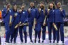 The United States' women 4x400-meter relay gold medalists stand on the podium, at the 2024 Summer Olympics, Saturday, Aug. 10, 2024, in Saint-Denis, France. (AP Photo/Matthias Schrader)