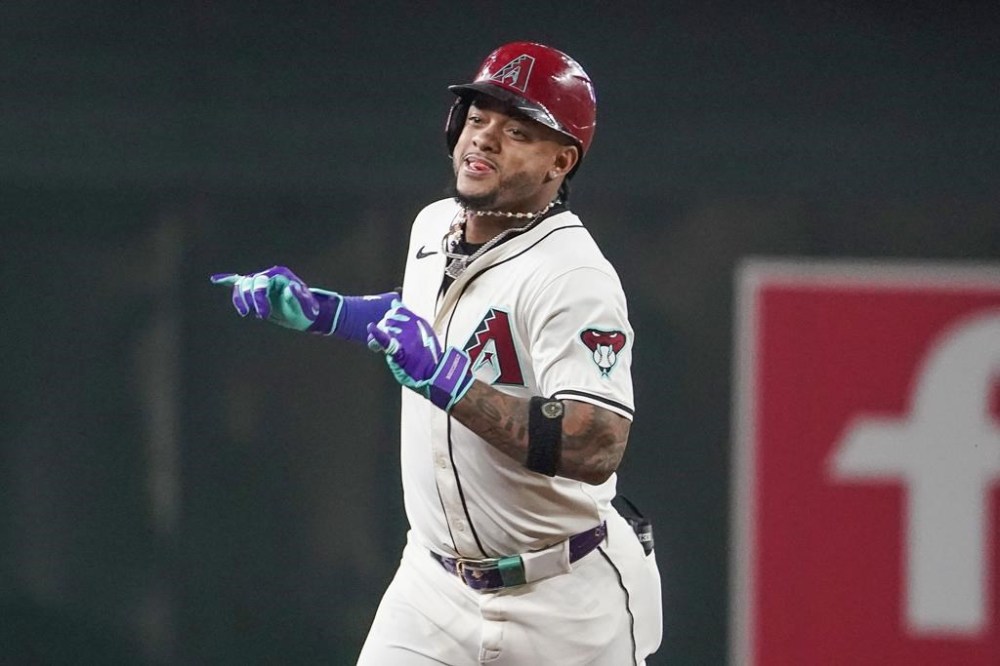 Arizona Diamondbacks' Ketel Marte celebrates after his solo-home run against the Philadelphia Phillies during the first inning of a baseball game Saturday, Aug 10, 2024, in Phoenix. (AP Photo/Darryl Webb)