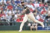 Washington Nationals shortstop Nasim Nunez throws out Los Angeles Angels' Logan O'Hoppe at first base during the first inning of a baseball game, Saturday, Aug. 10, 2024, in Washington. (AP Photo/John McDonnell)