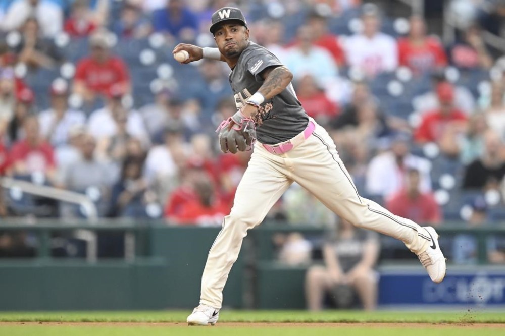 Washington Nationals shortstop Nasim Nunez throws out Los Angeles Angels' Logan O'Hoppe at first base during the first inning of a baseball game, Saturday, Aug. 10, 2024, in Washington. (AP Photo/John McDonnell)