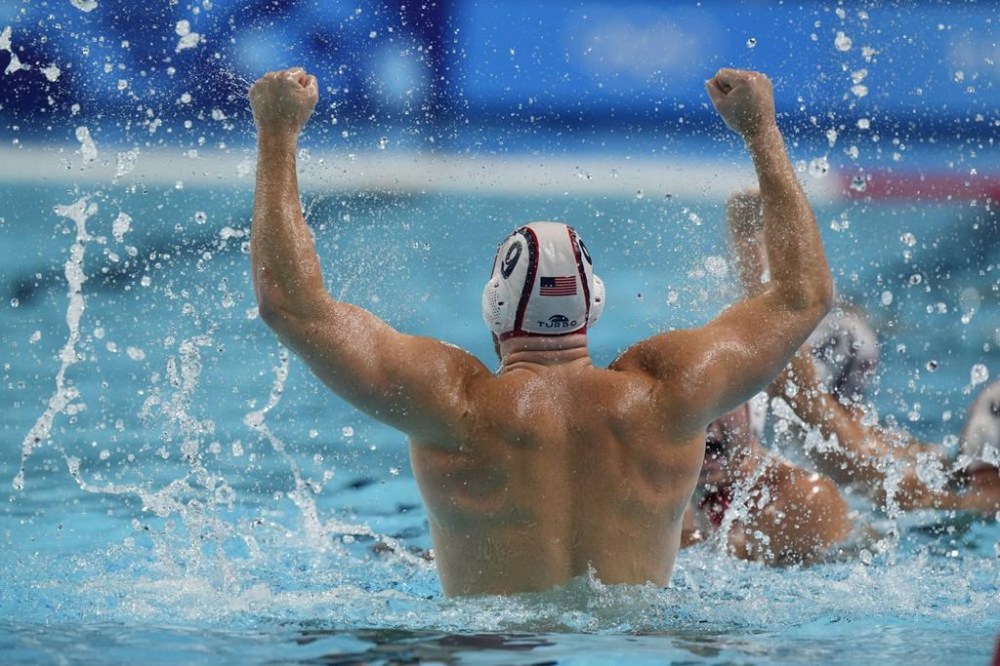 United States' Alex Bowen celebrates after winning the men's water polo bronze medal match against Hungary, at the 2024 Summer Olympics, Sunday, Aug. 11, 2024, in Paris, France. (AP Photo/Luca Bruno)