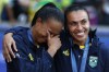 Brazil's Marta, right, consoles a teammate during the medal ceremony after the women's soccer gold medal match between Brazil and the United States at the Parc des Princes during the 2024 Summer Olympics, Saturday, Aug. 10, 2024, in Paris, France. (AP Photo/Aurelien Morissard)