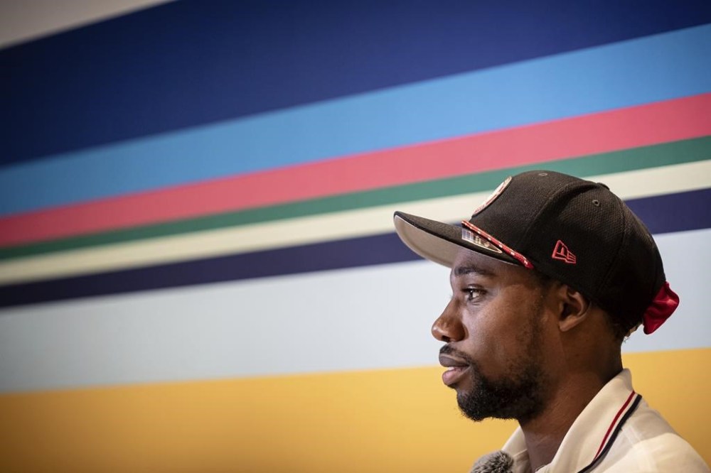 American Olympic champion Noah Lyles speaks before an interview in Paris, France, Sunday, Aug. 11, 2024. (AP Photo/Aurelien Morissard)