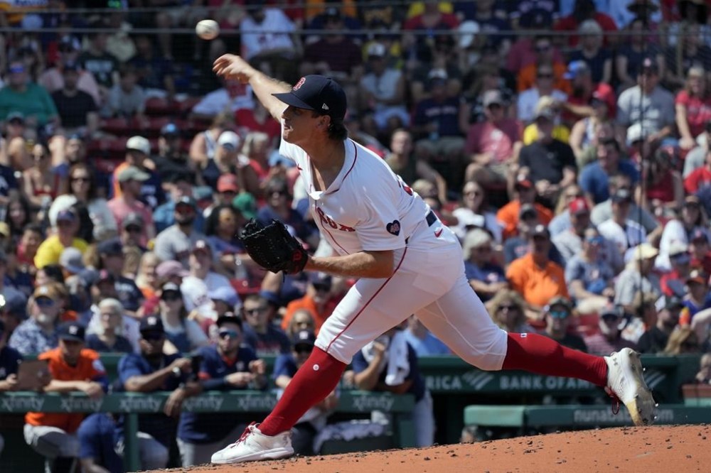 Boston Red Sox pitcher Lucas Sims throws during the second inning of a baseball game against the Houston Astros, Sunday, Aug. 11, 2024, in Boston. (AP Photo/Michael Dwyer)