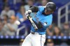 Miami Marlins' Xavier Edwards hits a single during the first inning of a baseball game against the San Diego Padres, Sunday, Aug. 11, 2024, in Miami. (AP Photo/Lynne Sladky)