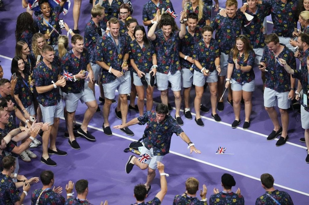 British athletes react during the 2024 Summer Olympics closing ceremony at the Stade de France, Sunday, Aug. 11, 2024, in Saint-Denis, France. (AP Photo/Rebecca Blackwell)