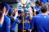 Seattle Mariners' Cal Raleigh is showered with sunflower seeds from teammates after hitting a home run during the sixth inning of a baseball game against the New York Mets, Sunday, Aug. 11, 2024, in Seattle. (AP Photo/Liv Lyons)