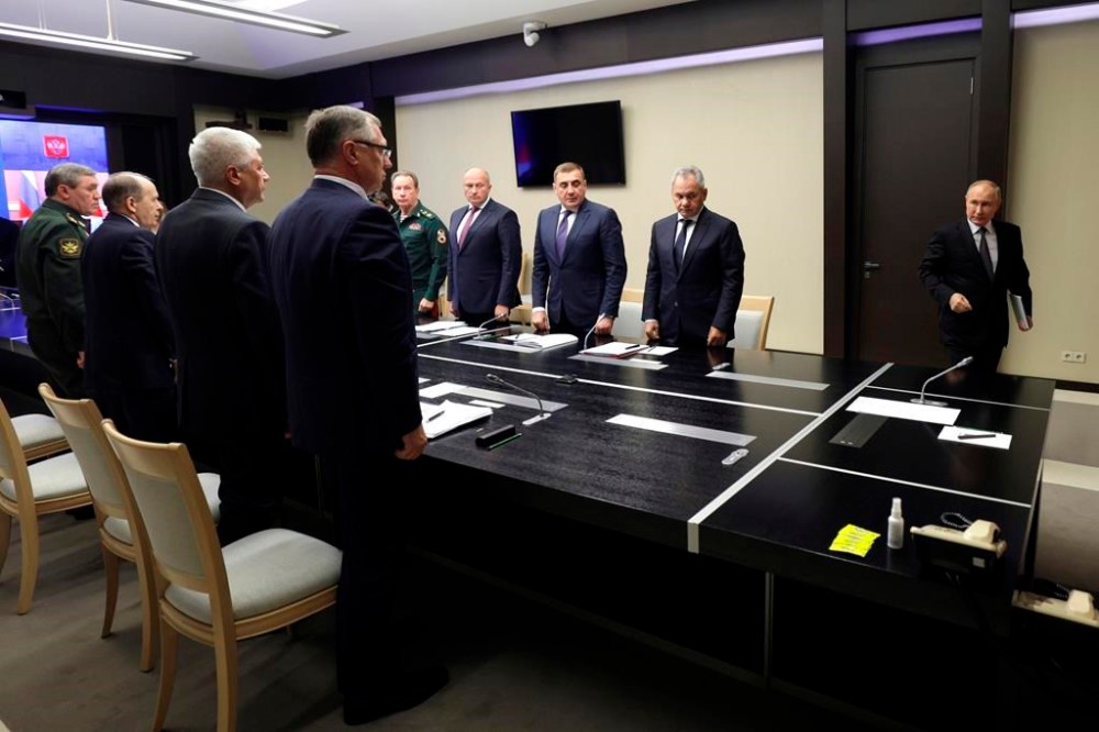 Russian President Vladimir Putin, right, leads the meeting with top security and defence officials dedicated to the situation in Kursk and Belgorod border regions, at Novo-Ogaryovo state residence outside of Moscow, Russia, Monday, Aug. 12, 2024. (Gavriil Grigorov, Sputnik, Kremlin Pool Photo via AP)