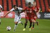 Toronto FC’s Richie Laryea (22) chases after York United FC’s Max Ferrari during first-half Canadian Championship quarterfinal soccer action in Toronto on Wednesday, Sept. 22, 2021. On Friday, the 23-year-old from Newmarket, Ont., is expected to make his 100th appearance for York United when the Toronto-based Canadian Premier League team hosts Calgary's Cavalry FC. THE CANADIAN PRESS/Jon Blacker