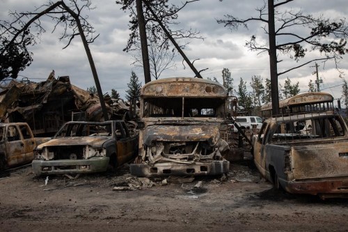 Burnt buses and cars in Jasper, Alta., on July 26, 2024. Human -caused climate change is making heat waves much more likely, the federal government says as 474 fires blaze across the country. That's according to Environment and Climate Change Canada's rapid extreme weather event attribution system, which compares today's climate to a pre-industrial one. THE CANADIAN PRESS/Amber Bracken
