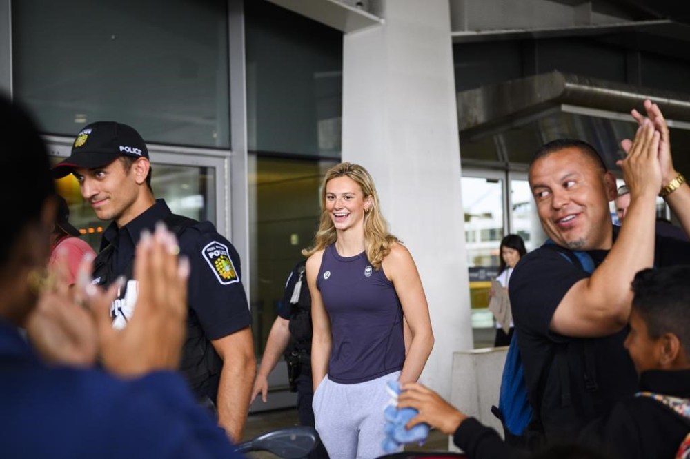 Olympic medalist Summer McIntosh is cheered by fans after arriving at Pearson airport following the 2024 Paris Olympic Games, in Toronto, Monday, Aug. 12, 2024. THE CANADIAN PRESS/Christopher Katsarov