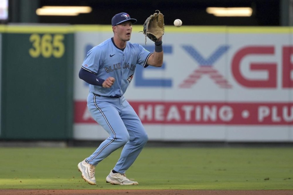 Toronto Blue Jays' Will Wagner makes a play at second base during the second inning of a baseball game against the Los Angeles Angels, Monday, Aug. 12, 2024, in Anaheim, Calif. (AP Photo/Jayne-Kamin-Oncea)