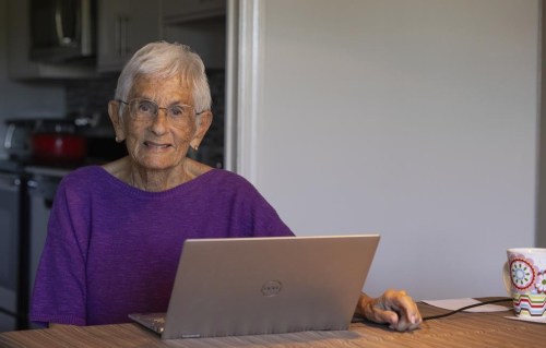 Barbara Winston, 89, sits for a portrait at her home in Northbrook, Ill., on Sunday, June 30, 2024. When she got home from an artificial intelligence class, the retired professor downloaded books on the technology, researched the platforms she wanted to use from her kitchen table and eventually queried ChatGPT about how to treat a personal medical ailment. (AP Photo/Teresa Crawford)