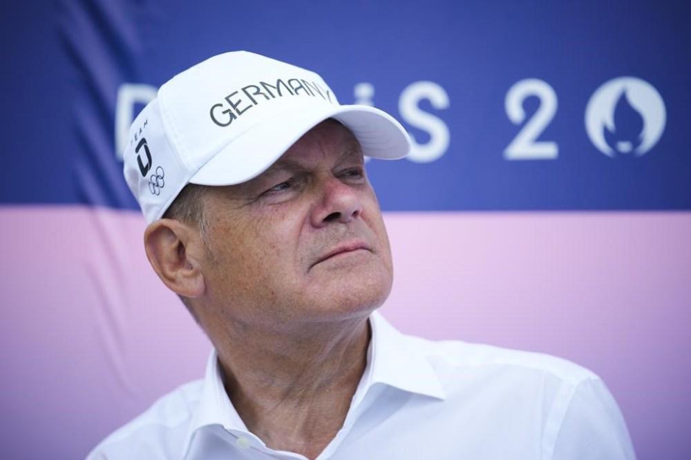 German Chancellor Olaf Scholz attends canoe sprint finals at the 2024 Summer Olympics, Friday, Aug. 9, 2024, in Vaires-sur-Marne, France. (AP Photo/Ebrahim Noroozi)
