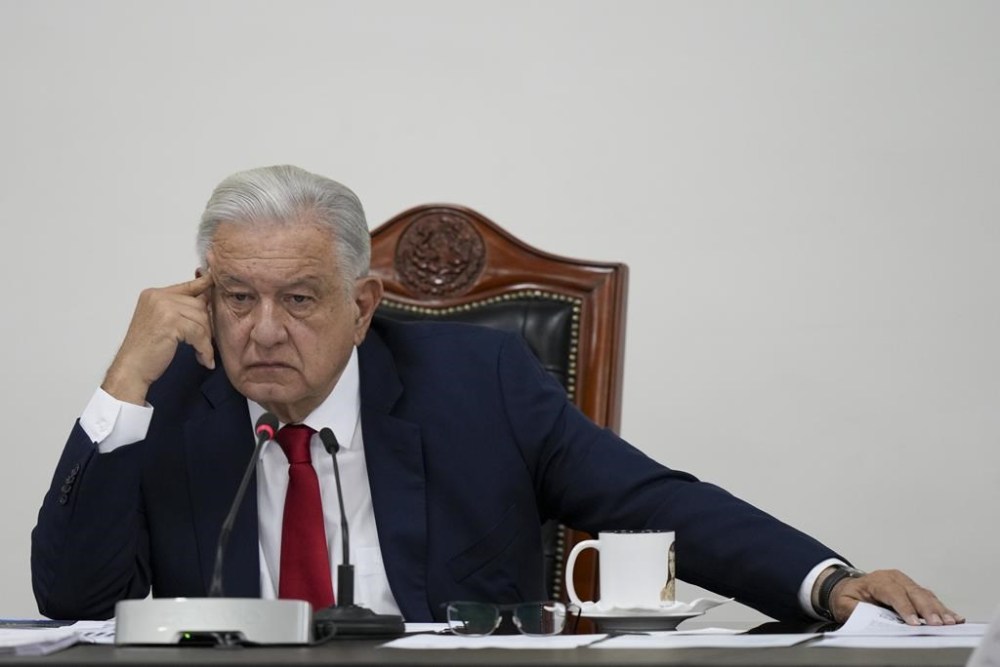Mexican President Andres Manuel Lopez Obrador meets with his security cabinet at the National Place in Mexico City, Friday, Aug. 2, 2024. (AP Photo/Fernando Llano)