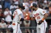 Baltimore Orioles' Anthony Santander (25) celebrates with Gunnar Henderson (2) after hitting a home run during the third inning of a baseball game against the Washington Nationals, Tuesday, Aug. 13, 2024, in Baltimore. (AP Photo/Stephanie Scarbrough)