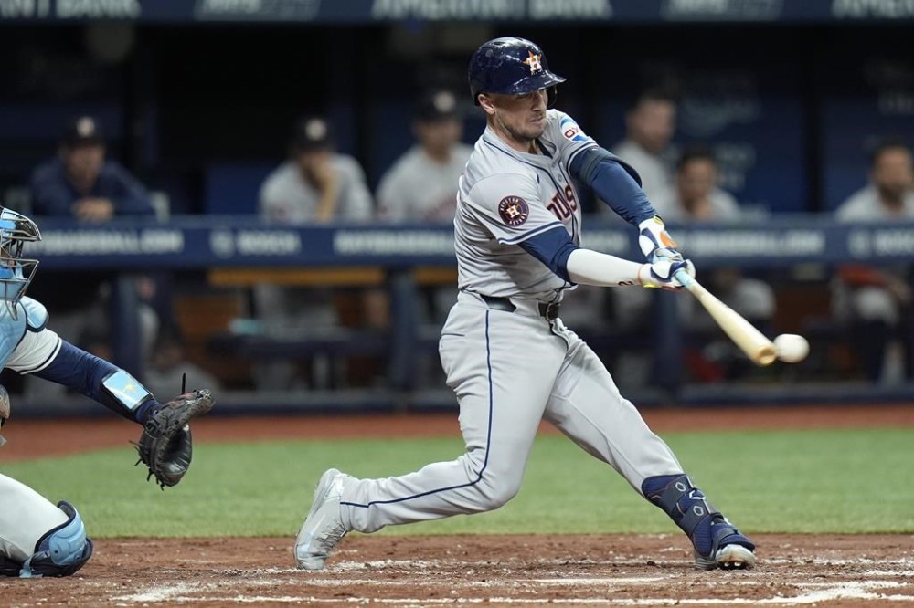 Houston Astros' Alex Bregman lines a double off Tampa Bay Rays starting pitcher Shane Baz during the third inning of a baseball game Tuesday, Aug. 13, 2024, in St. Petersburg, Fla. (AP Photo/Chris O'Meara)
