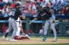 Miami Marlins' Jake Burger, left, celebrates his home run with Jesus Sanchez, right, during the third inning of a baseball game against the Philadelphia Phillies, Tuesday, Aug. 13, 2024, in Philadelphia. (AP Photo/Chris Szagola)