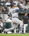New York Yankees' Juan Soto watches his two-run home run off Chicago White Sox starting pitcher Jonathan Cannon during the third inning of a baseball game Tuesday, Aug. 13, 2024, in Chicago. (AP Photo/Charles Rex Arbogast)